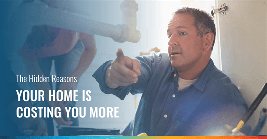 A man, possibly a plumber, points under a sink while explaining something, with white pipes visible. Text overlay reads: "The Hidden Reasons YOUR HOME IS COSTING YOU MORE".