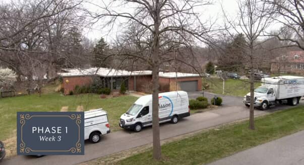 Work vans parked outside a home